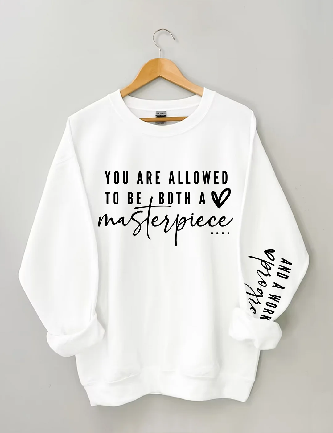 You Are Allowed To Be Both A Masterpiece And A Work In Progress Sweatshirt